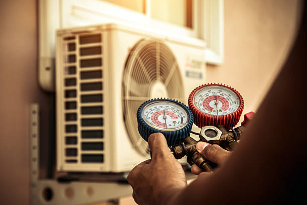 Professional Air Conditioning Service technician working in Farmingdale, NJ